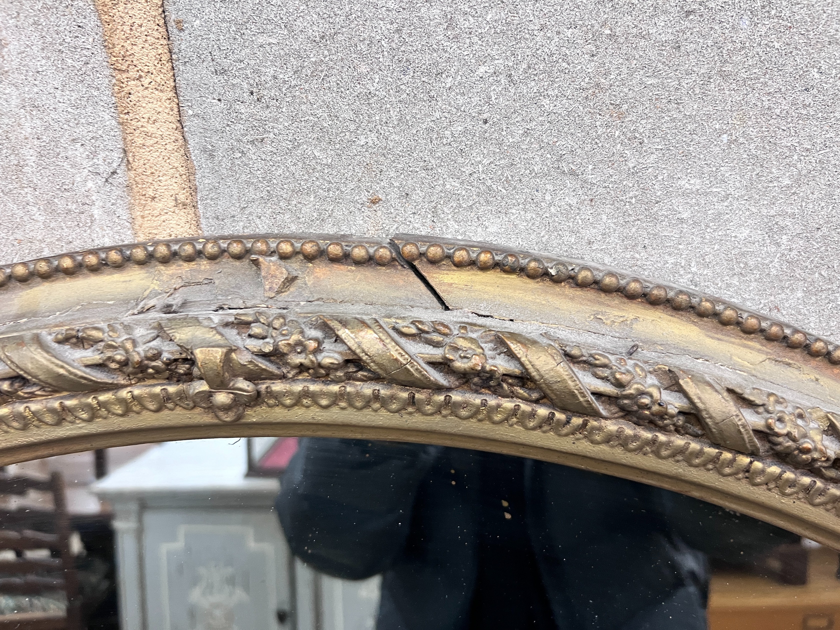 A late Victorian gilt gesso overmantel mirror, width 144cm, height 150cm *Please note the sale commences at 9am.